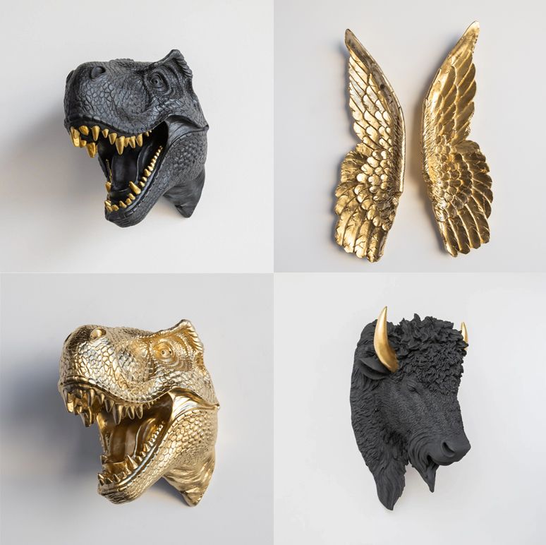 Tierköpfe in Schwarz-Gold